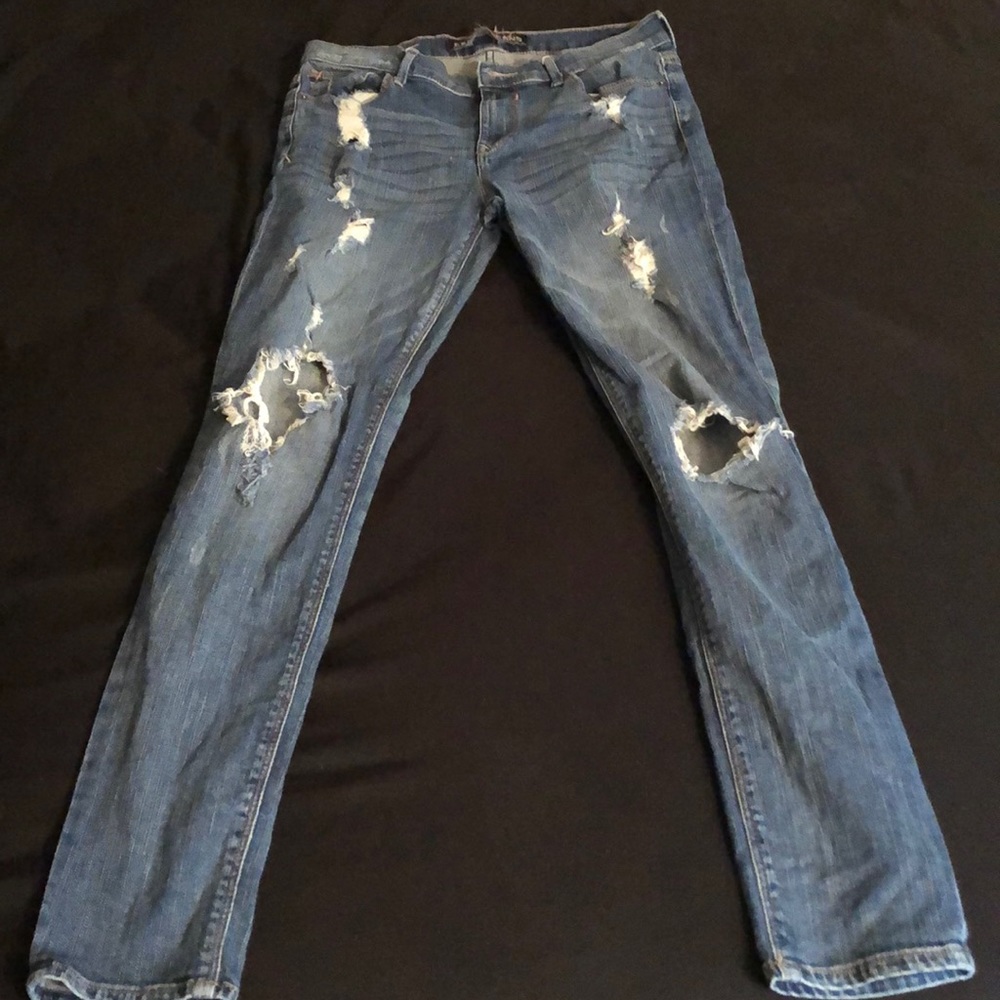 Ripped dark blue jeans